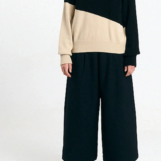 Jersey Luso bicolor black de Suite13Lab en algodón orgánico, cuello alto y mangas raglán