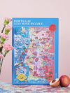 Puzzle de 1000 piezas que representa un mapa ilustrado de Portugal con sus regiones vinícolas, variedades de uva y elementos culturales sobre un fondo azul oscuro.