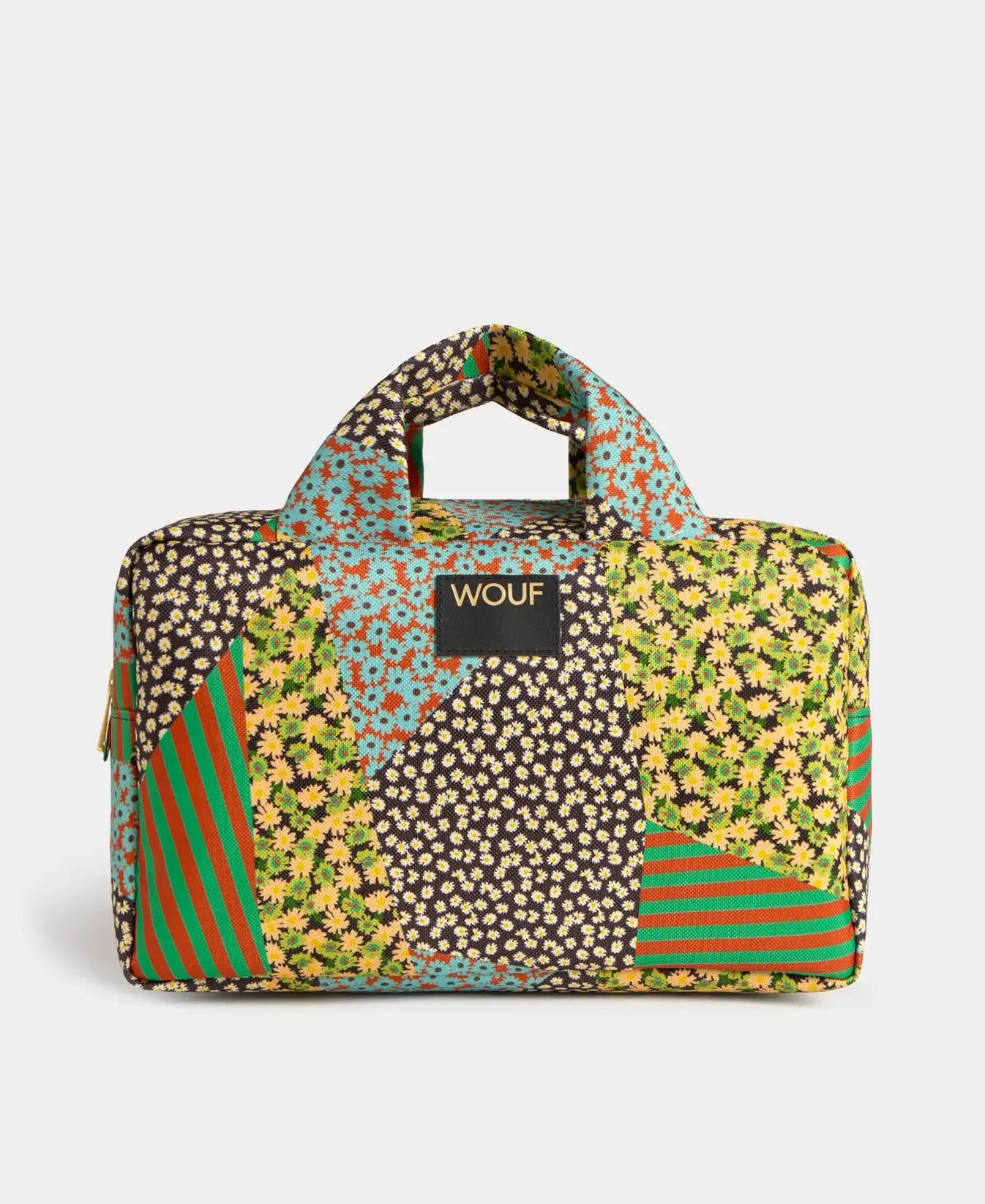 Neceser grande de la marca Wouf con estampado floral estilo bohemio, compartimento con cremallera y etiqueta de cuero reciclado, fabricado en Barcelona.