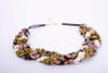 Collar Rianxeira de Montse Betanzos: caracoles enteros y
fragmentos de concha blanca, cierre dorado con alargador.