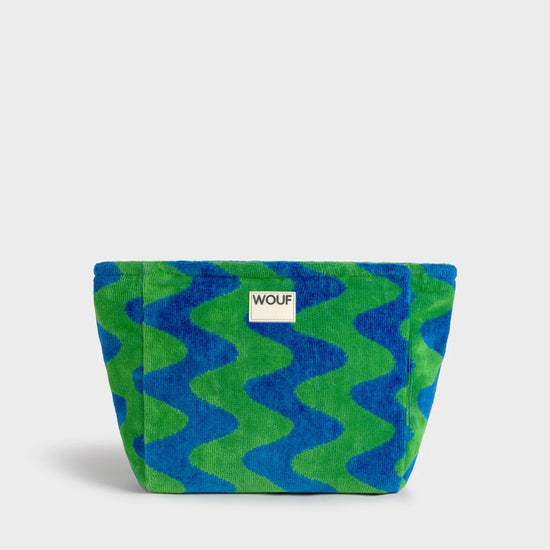 Neceser de tamaño grande en tejido jacquard de rizo de algodón orgánico, con tirador de cordón y etiqueta de silicona de la colección Terry de Wouf.