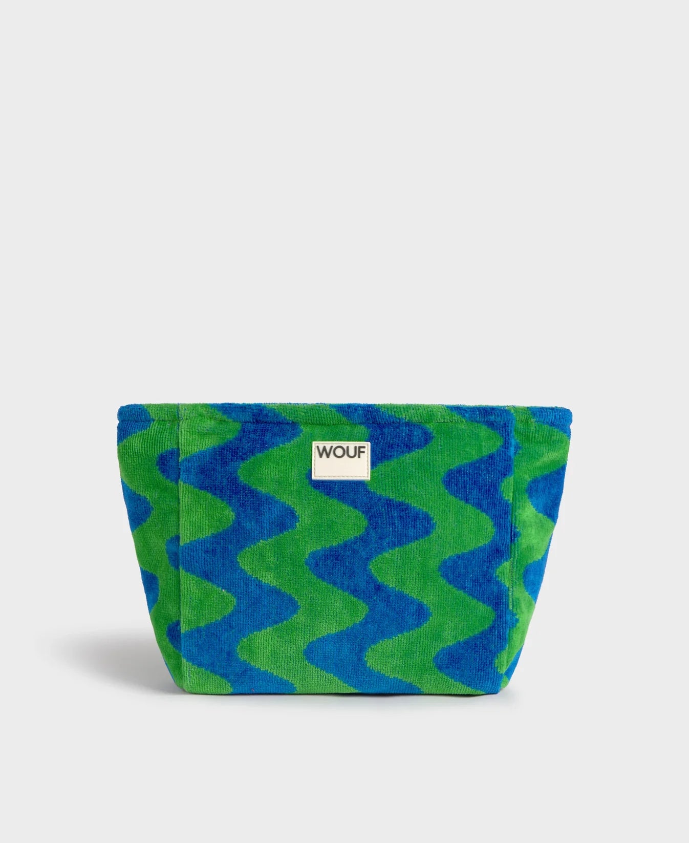 Neceser de tamaño grande en tejido jacquard de rizo de algodón orgánico, con tirador de cordón y etiqueta de silicona de la colección Terry de Wouf.