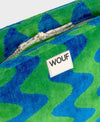Neceser de tamaño grande en tejido jacquard de rizo de algodón orgánico, con tirador de cordón y etiqueta de silicona de la colección Terry de Wouf.