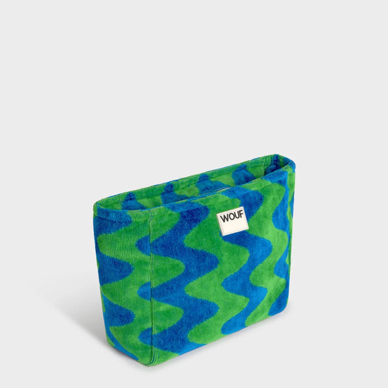 Neceser de tamaño grande en tejido jacquard de rizo de algodón orgánico, con tirador de cordón y etiqueta de silicona de la colección Terry de Wouf.