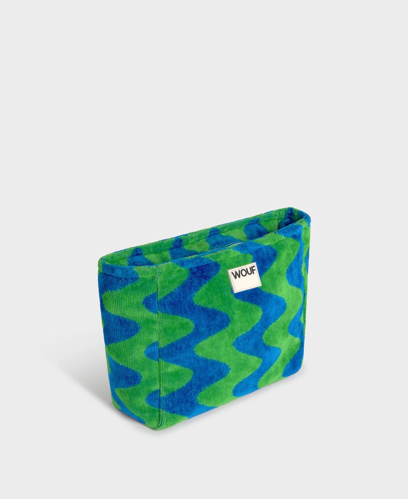 Neceser de tamaño grande en tejido jacquard de rizo de algodón orgánico, con tirador de cordón y etiqueta de silicona de la colección Terry de Wouf.