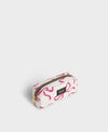 Neceser de maquillaje con estampado floral de la colección Rita de Wouf, con cierre de cremallera superior, etiqueta de cuero reciclado y fondo en tonos cálidos.