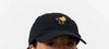Gorra estructurada estilo béisbol en color beige bicolor con visera curvada y detalle bordado, fabricada en algodón orgánico certificado por Suite13 Lab.