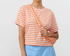 Bolso bandolera Janno Moonbag a cuadros naranja de Suite13Lab, forma media luna en algodón orgánico GOTS.