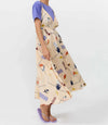 Vestido midi de algodón orgánico y lino con estampado Holiday, tirantes largos ajustables para varias posiciones, escote en pico y espalda descubierta de Suite13 Lab.