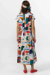 Falda midi de tejido fluido con estampado artístico de barcos y motivos marinos en azul sobre fondo crema, con una abertura lateral en el bajo.