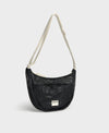 Bolso bandolera de color negro puro, de diseño estructurado con correa cruzada ajustable de algodón, cremallera superior y etiqueta de silicona, modelo Onyx de Wouf.