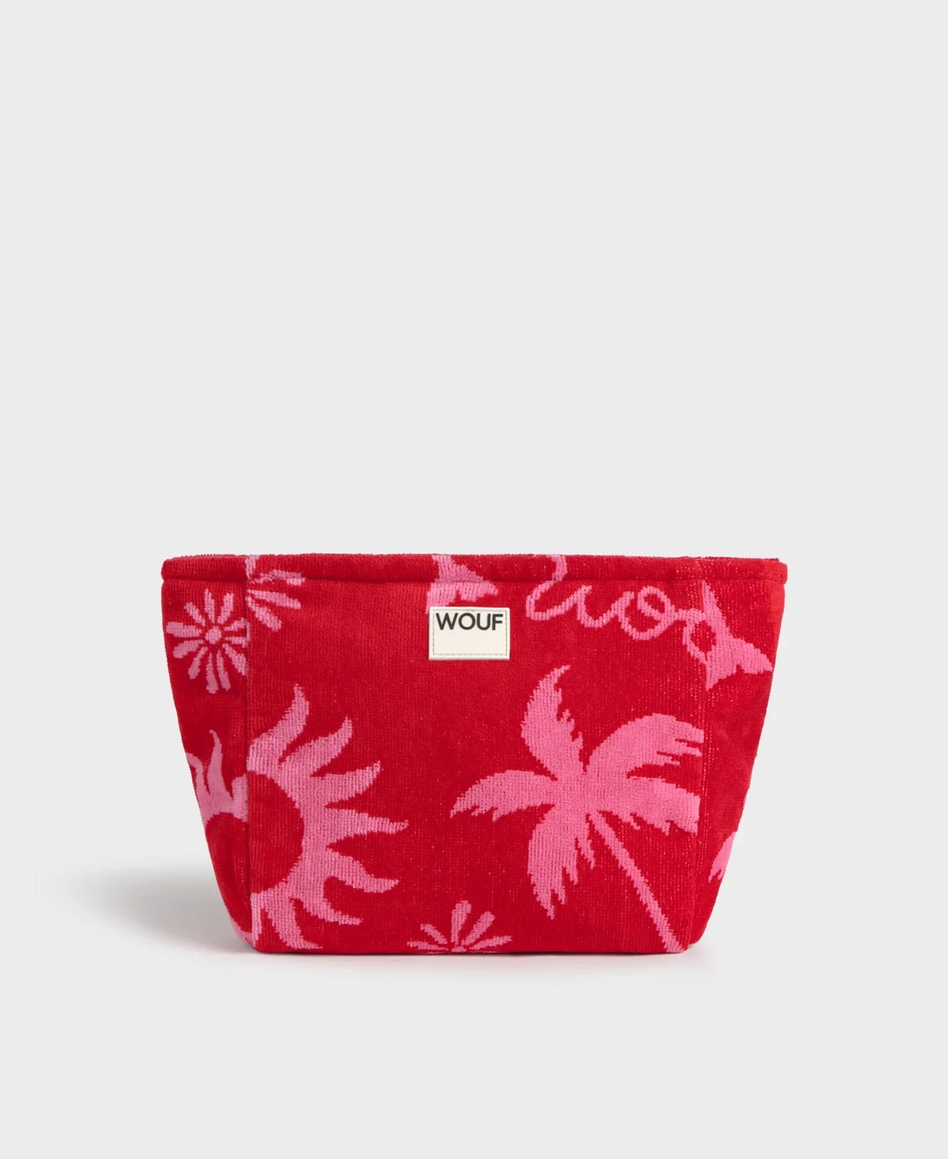 Neceser de tamaño grande en suave tela de rizo jacquard de algodón orgánico, con cremallera y etiqueta de silicona, modelo Tulum de la marca Wouf.