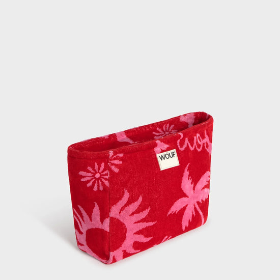 Neceser de tamaño grande en suave tela de rizo jacquard de algodón orgánico, con cremallera y etiqueta de silicona, modelo Tulum de la marca Wouf.