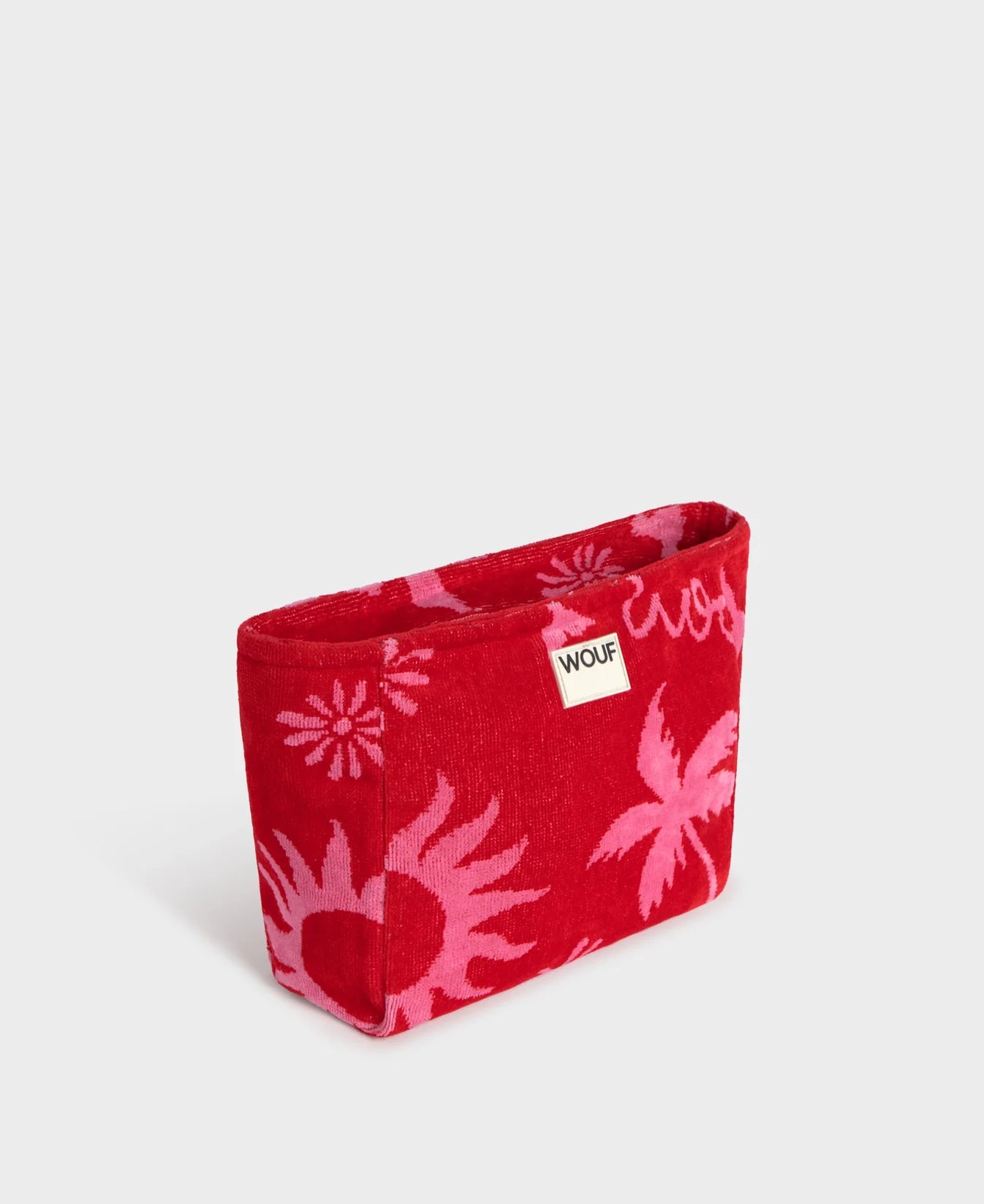 Neceser de tamaño grande en suave tela de rizo jacquard de algodón orgánico, con cremallera y etiqueta de silicona, modelo Tulum de la marca Wouf.