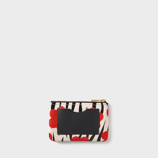 Cartera Wildflower de Wouf, 13×9 cm, poliéster reciclado con estampado floral y ranura de cuero reciclado.