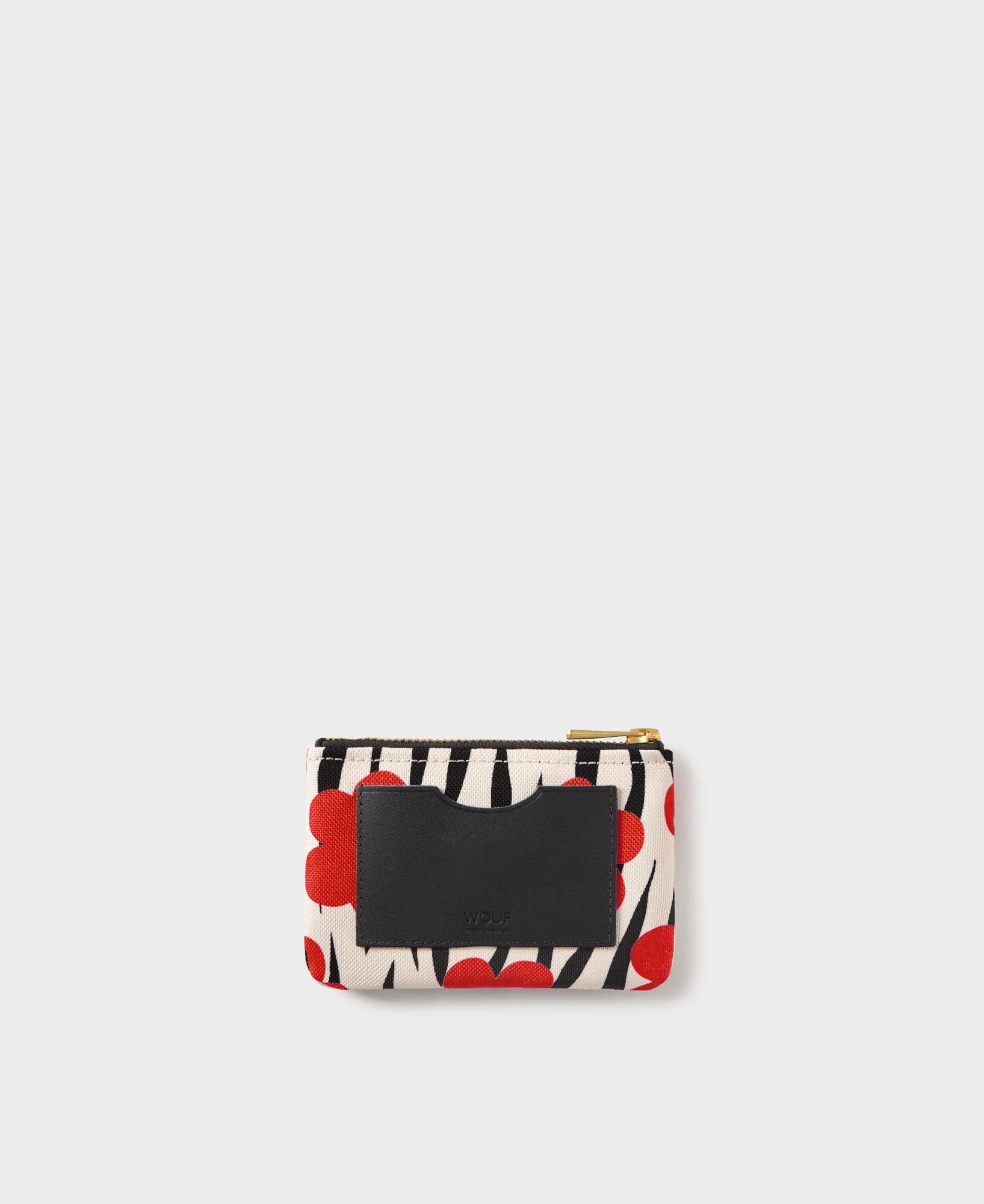 Cartera Wildflower de Wouf, 13×9 cm, poliéster reciclado con estampado floral y ranura de cuero reciclado.