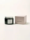 Vela aromática en envase de vidrio ámbar, colección 05 28004 de Eleven People, fragancia grosella negra abedul y musgo de roble, elaborada artesanalmente en Asturias